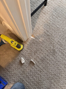 A carpet cleaning machine in a long hallway, showing the progress of carpet cleaning by B's Carpet Cleaning in Saint George, UT.