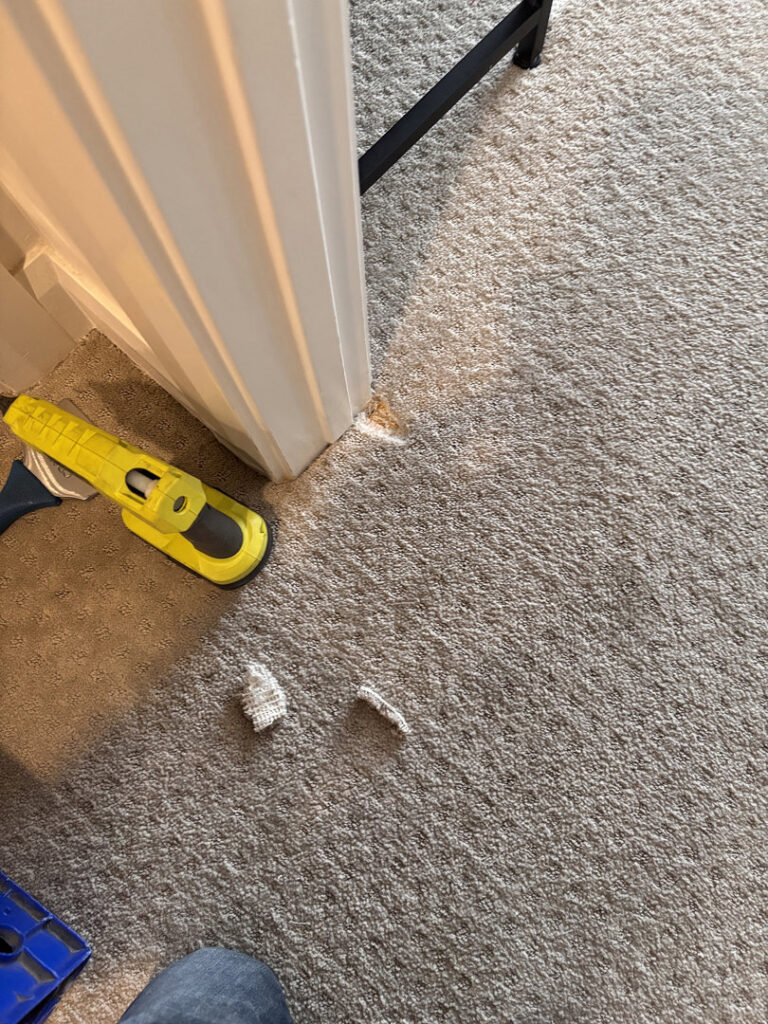 A carpet cleaning machine in a long hallway, showing the progress of carpet cleaning by B's Carpet Cleaning in Saint George, UT.