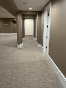 A long hallway featuring a new light beige carpet installation by CR Flooring in Atlanta, GA