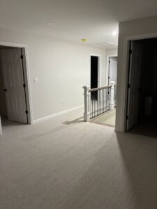 A newly installed light-colored carpet in a residential hallway by Messina's Flooring & Carpet in Salem, NH.