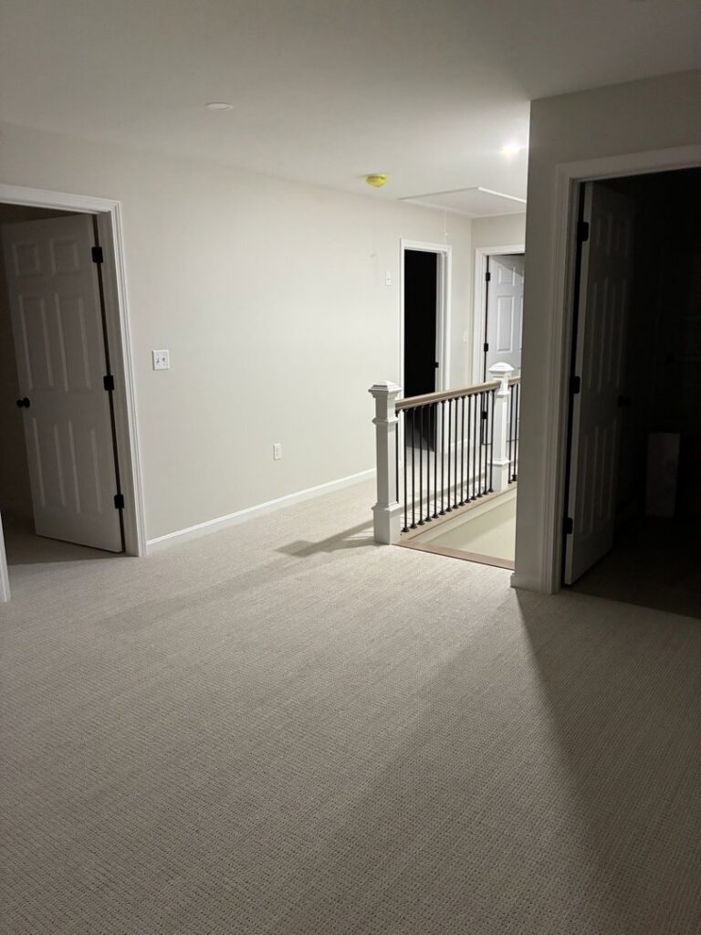 A newly installed light-colored carpet in a residential hallway by Messina's Flooring & Carpet in Salem, NH.