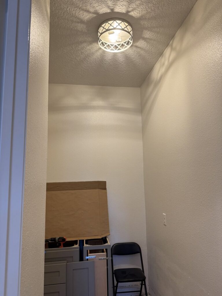 A newly installed ceiling light fixture in a hallway by Crawford Electric Services, LLC in Kings Mountain, NC.