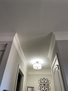 A newly installed drum pendant ceiling light fixture illuminating a hallway by All Connected Electric LLC in Raleigh, NC.