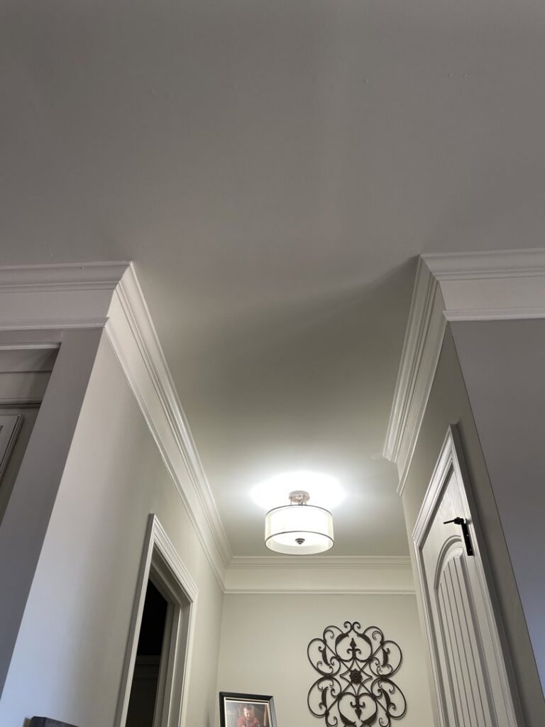 A newly installed drum pendant ceiling light fixture illuminating a hallway by All Connected Electric LLC in Raleigh, NC.