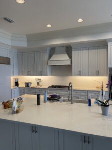 A hallway illuminated by stylish floor-level accent lighting, installed by Johnson Electric in Port Angeles, WA.