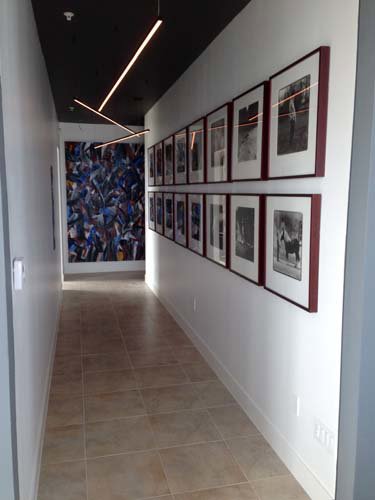 A modern hallway featuring linear ceiling lights installed by Christensen Electric in Galveston, TX.