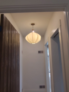 A unique pendant light fixture installed in a hallway ceiling by Ryco Electric in York, PA