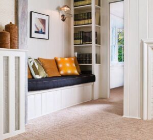 A comfortable hallway reading nook with new carpet installed by Wall To Wall Carpet One Floor & Home in Eau Claire, WI
