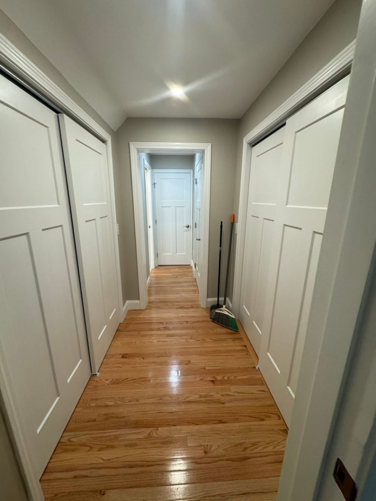 A brightly lit hallway featuring a recessed ceiling light installed by P. Cruz Electric LLC in Springfield, MA.