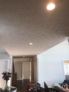 Bright recessed lighting installed in a residential hallway by TGR Electric LLC, enhancing visibility in Carmel, IN.