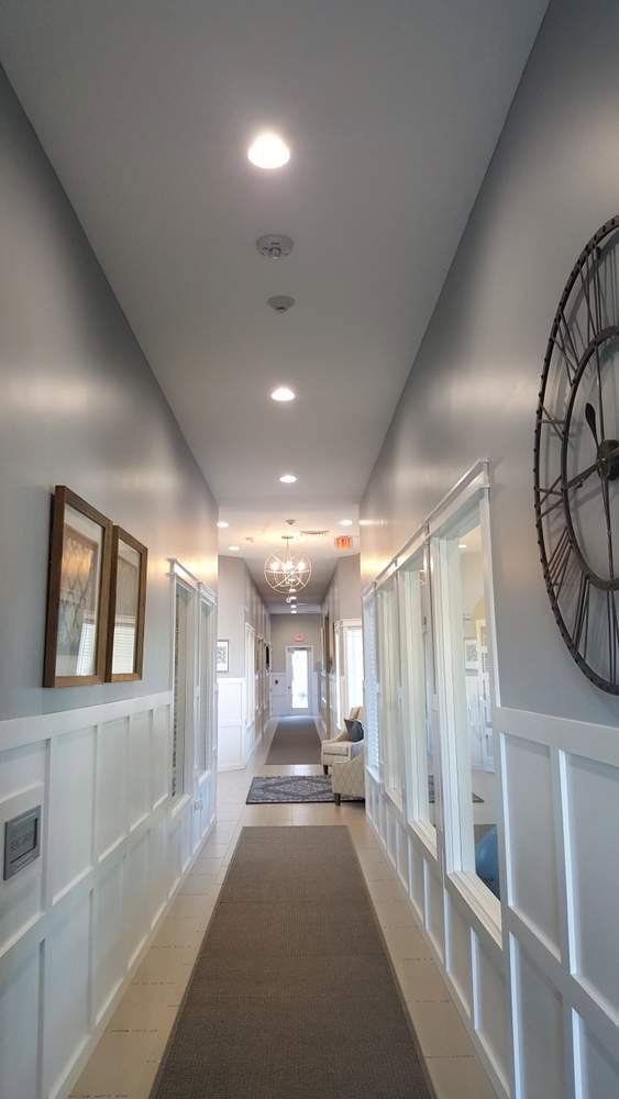 A hallway with modern recessed lighting installed by Safehouse Electric Company in Blue Springs, MO.