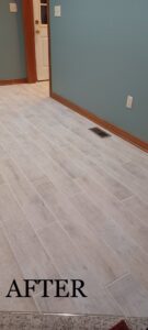 Completed light tile flooring installation in a hallway by Fabric Town Interiors, a floor contractor in Huntington, WV.