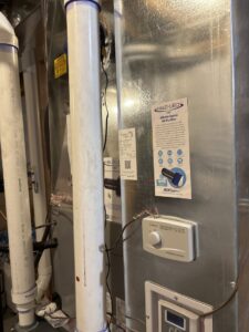 A HALO-LED whole home air purifier installed on an HVAC system by APEX Clean Air in South Salt Lake, UT.