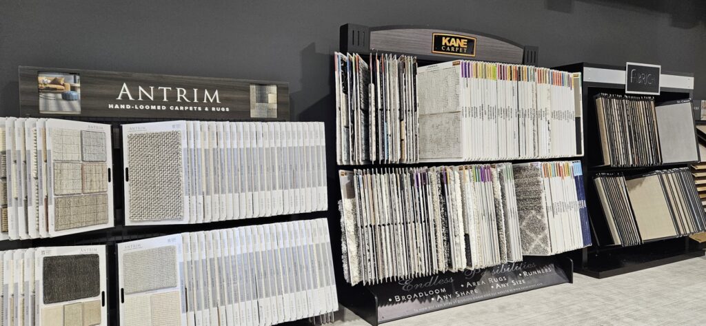 Showroom display featuring hand-loomed carpet and rug samples at Flooring NuVo in Gretna, NE.