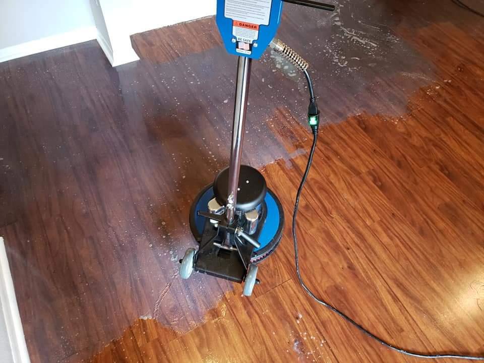 A floor scrubbing machine cleaning a hard floor by My Carpet Cleaning & Restoration Services in Silver Spring, MD.