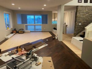 Hardwood flooring installation in progress with tools and materials at a job site by Marion's Carpet & Flooring Warehouses in Portland, OR.