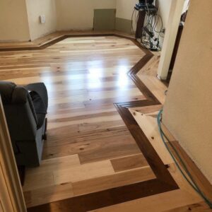 Newly installed hardwood flooring with a decorative border by Sulcas Carpets & more in Elk Grove, CA