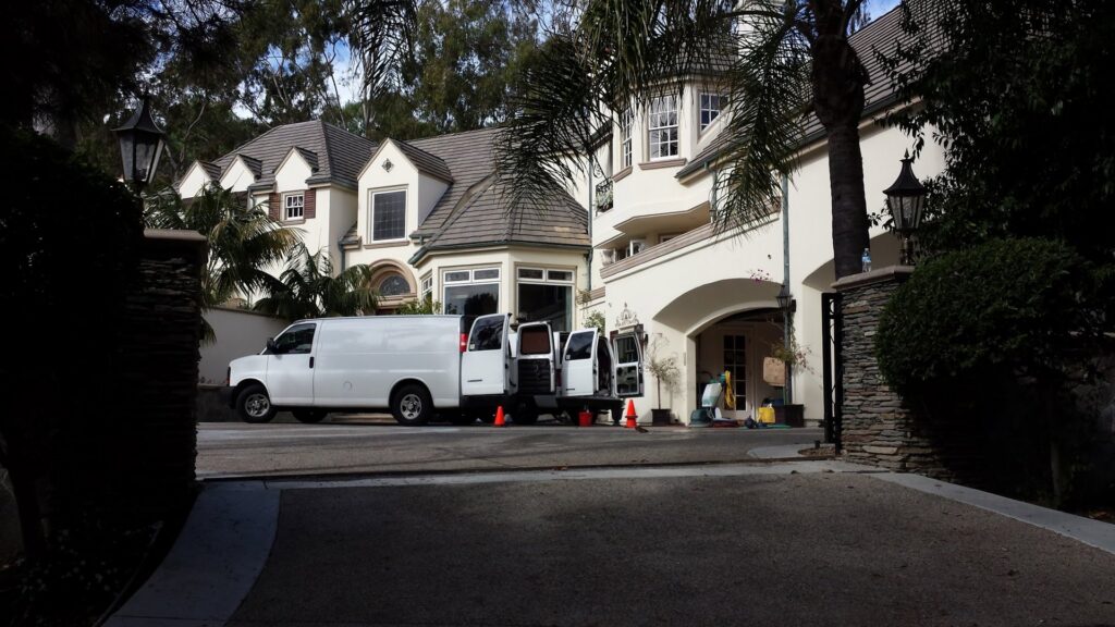 A Harper's Cleaning Services van parked at a residential property in Anaheim, CA, ready for a job.