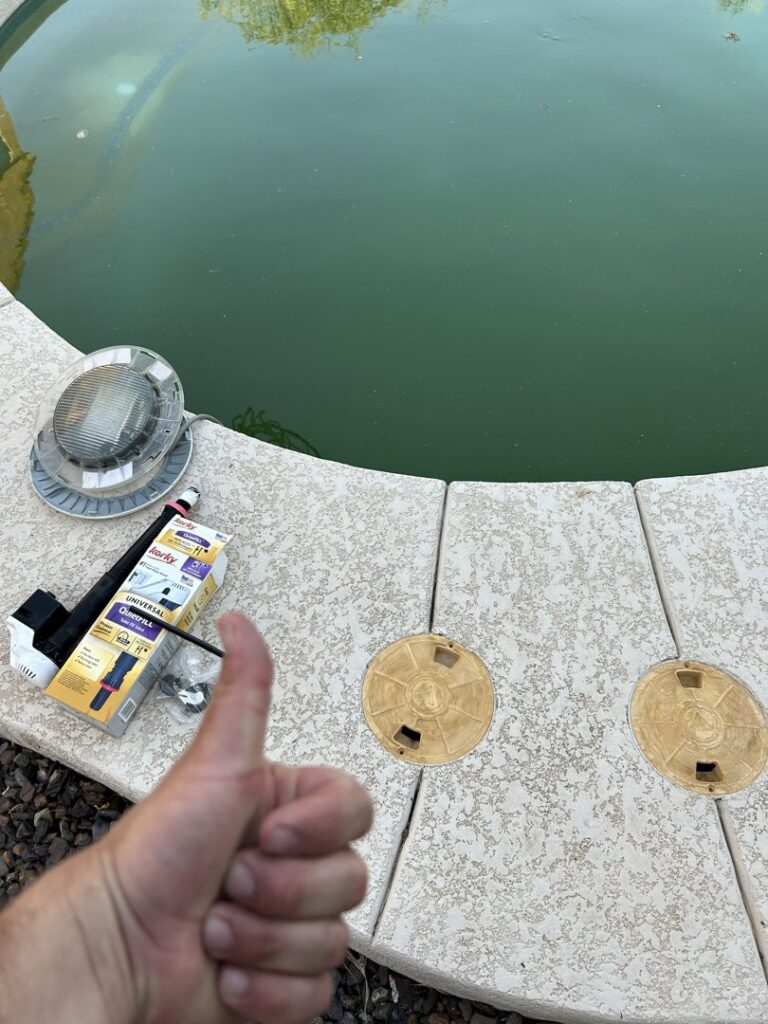 A thumbs-up next to a newly installed Hayward OmniPL pool control panel by Classic Pool Service in Surprise, AZ