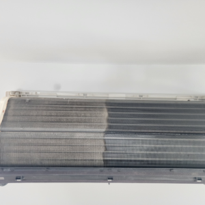 A heat pump coil showing a clear before and after cleaning comparison by Element Heat Pumps in Gray, ME.