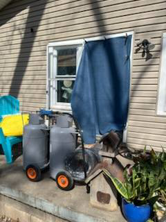 Propane tanks and heat treatment equipment set up outside a residential home by All Seasons Pest Control LLC in Topeka, KS.
