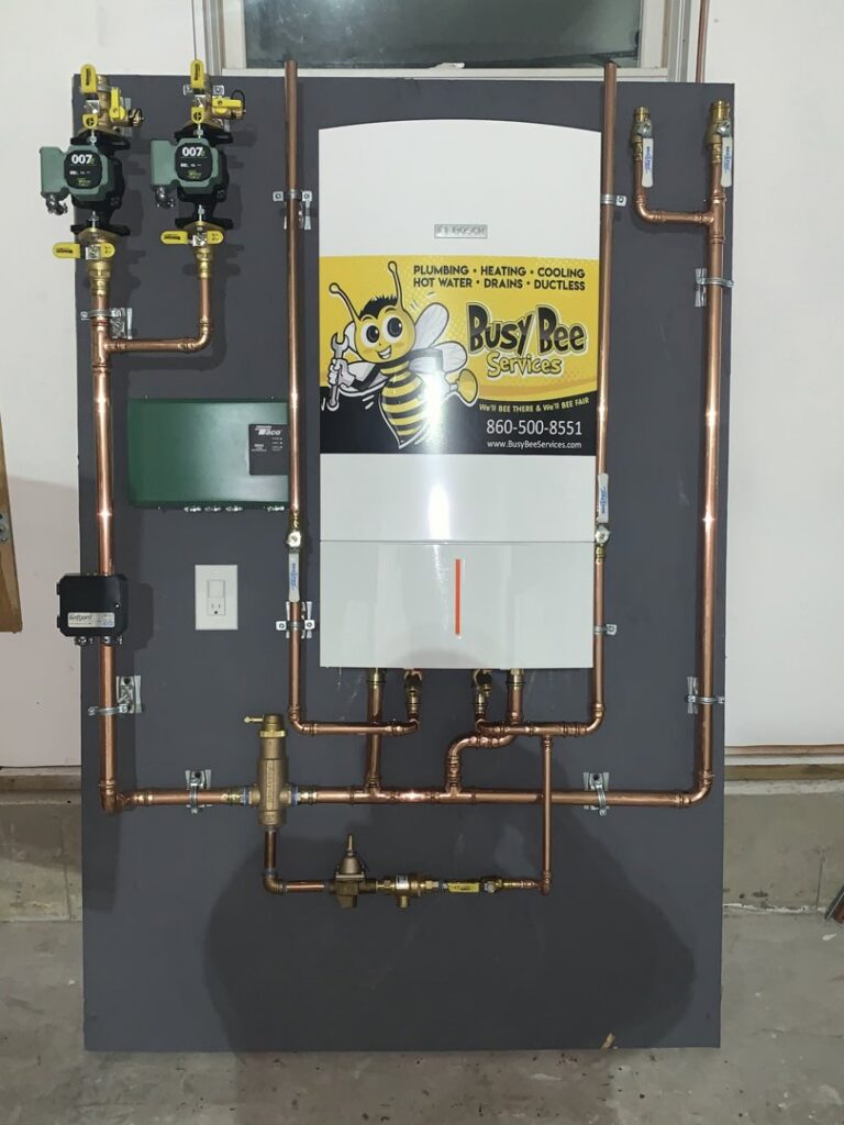 A newly installed heating boiler or hot water manifold system by Call The Bee Plumbing, Heating, Air & Electric in Farmington, CT.