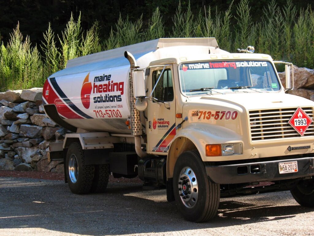 A Maine Heating Solutions heating fuel delivery truck parked on a sunny day in South Portland, ME.