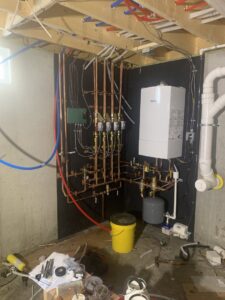 A heating system and boiler installation with PEX and copper piping by Excel Mechanical and Construction LLC in Brunswick, ME