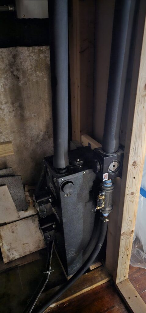 Installation of a heating system component with insulated pipes by Ultra Installs in Barrington, NH