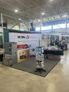 HeatSource Mechanical's HVAC trade show booth displaying heating and water system equipment in Wasilla, AK.