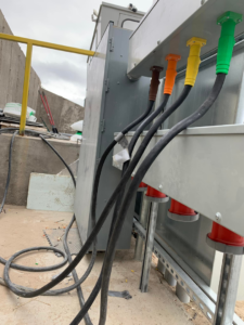 Heavy-duty electrical cables connected to a distribution panel by GDS Electric Inc. in Colorado Springs, CO