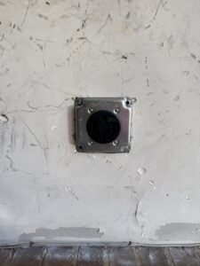 A heavy-duty electrical outlet installation on a wall by LivElectric in Garner, NC.