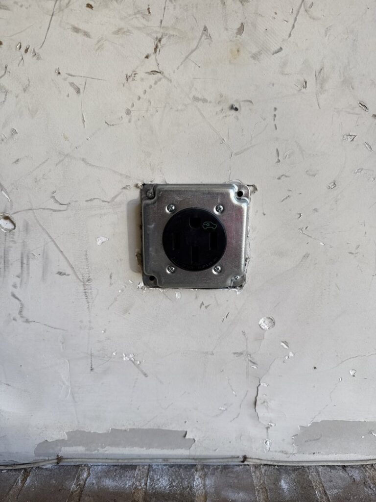 A heavy-duty electrical outlet installation on a wall by LivElectric in Garner, NC.