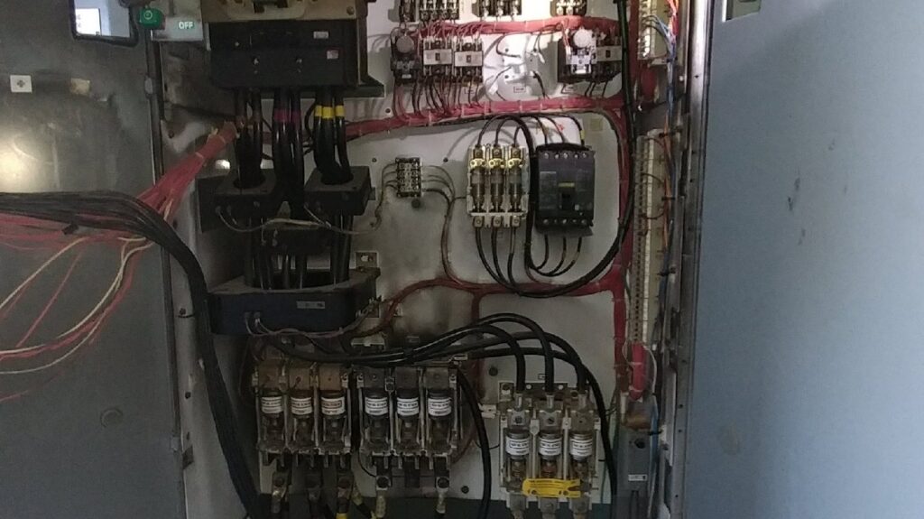 Heavy gauge electrical cables being installed into service boxes by A Renewable Electric LLC in Houston, TX.