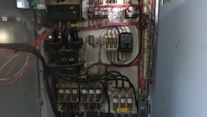 Heavy gauge electrical cables being installed into service boxes by A Renewable Electric LLC in Houston, TX.