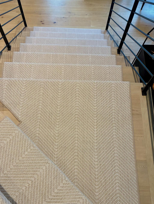 Beautiful herringbone pattern carpet installed on a residential staircase by Trademark Flooring in West Jordan, UT.