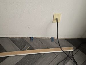 Herringbone pattern flooring installation in progress by Carpet Warehouse and Color Tile in Coeur d'Alene, ID.