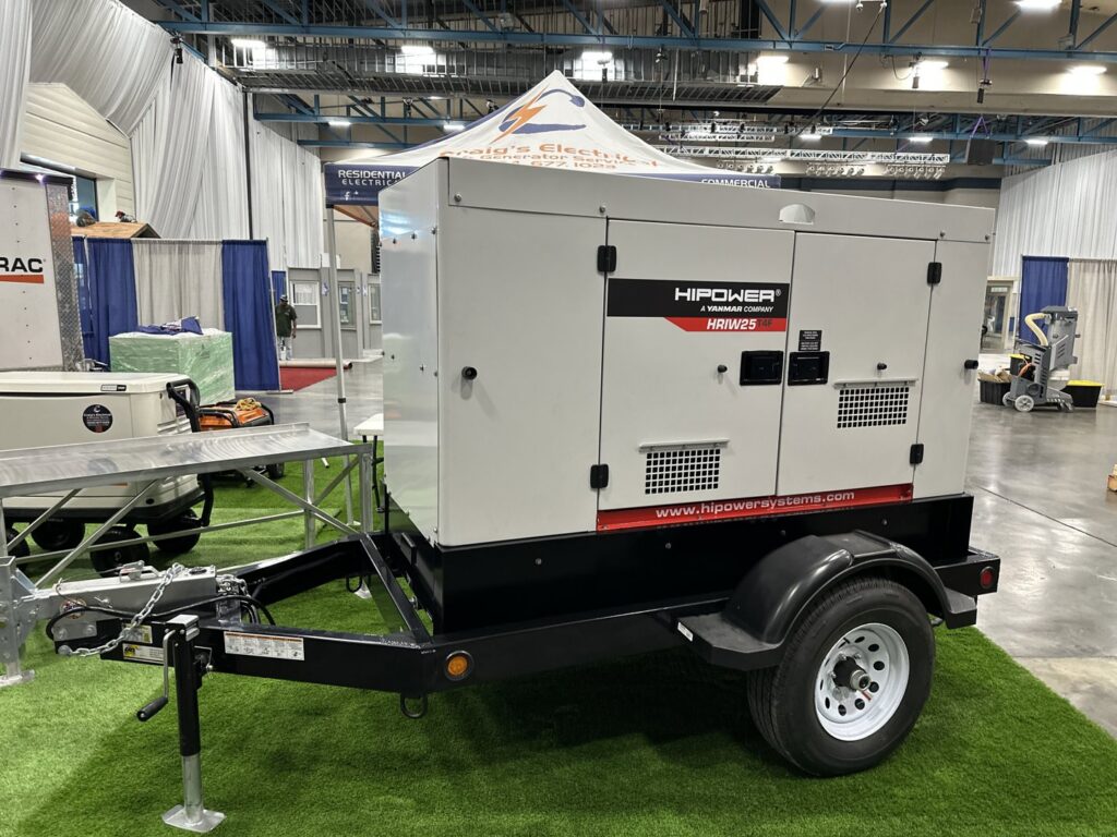 A portable HiPower generator on a trailer, displayed at a trade show by Craig's Electrical and Generator Service in Kenner, LA.
