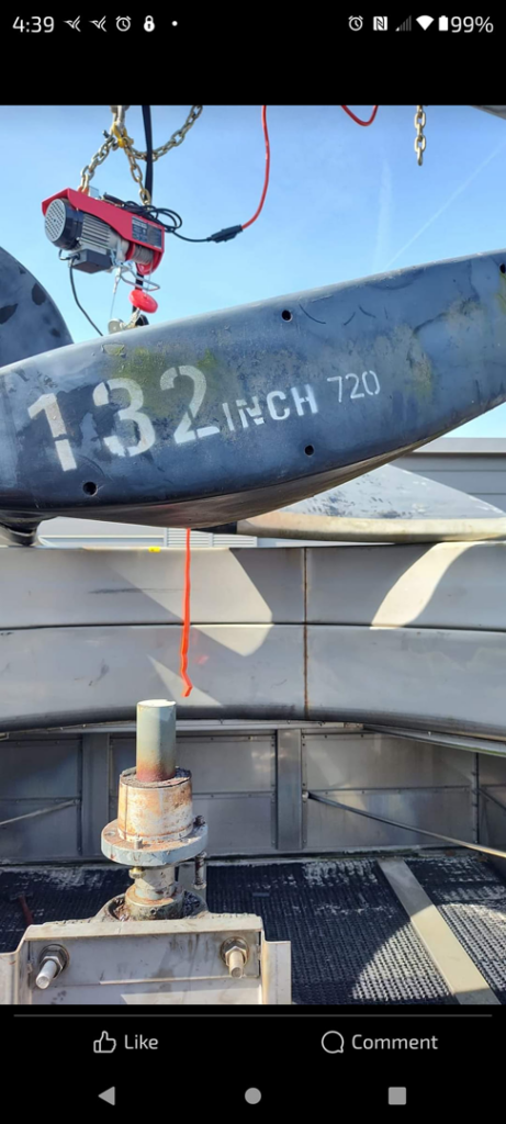 A hoist system lifting a 132-inch industrial HVAC fan blade during installation or maintenance by CMC Mechanical in Goose Creek, SC.