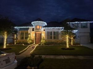 Holiday outdoor house lighting installed by Big City Lighting and Electric in Houston, TX.