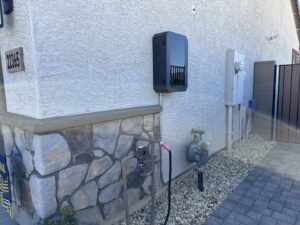 Exterior home view with an electrical meter and battery storage system installed by Pro Solutions Electric in Glendale, AZ.