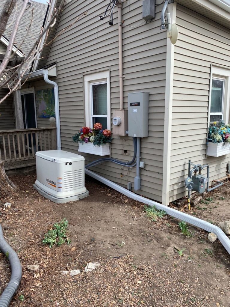 Exterior of a home showing a Generac generator and electrical service panel installed by Innovative Electric in Wichita, KS.