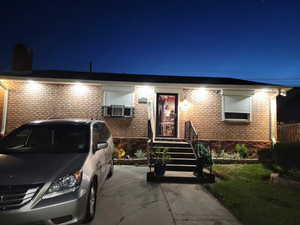 An upgraded home exterior with new lighting fixtures installed by Light of the World Electric in Lake City, FL.