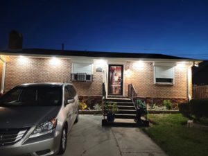 An upgraded home exterior with new lighting fixtures installed by Light of the World Electric in Lake City, FL.