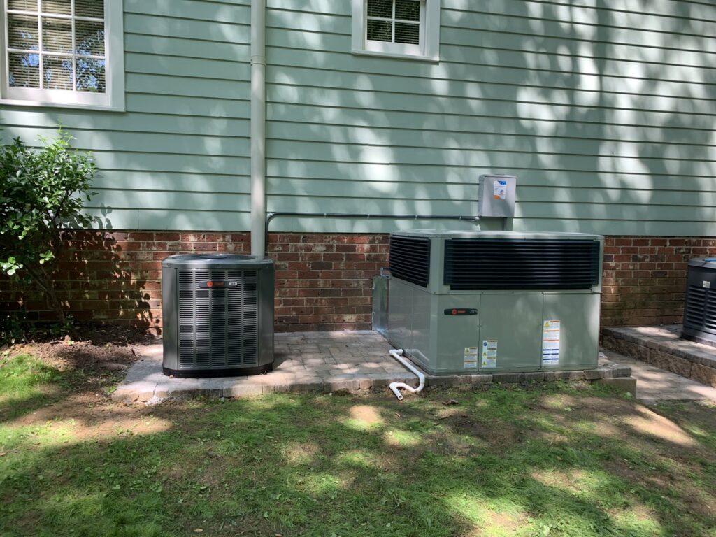 New outdoor HVAC condenser and package units installed at a residential property by Breeze Heating & Cooling Nashville in Nolensville, TN.