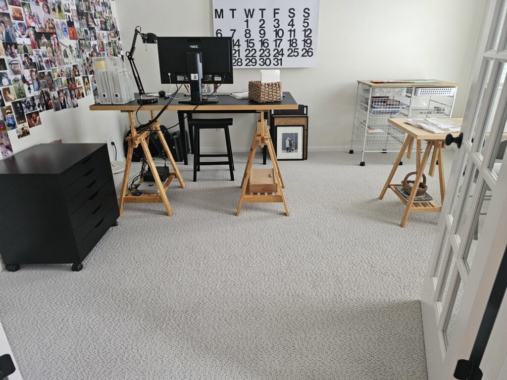 A bright home office featuring a new grey carpet installation by Absolute Floor Covering, Inc in Kentwood, MI.