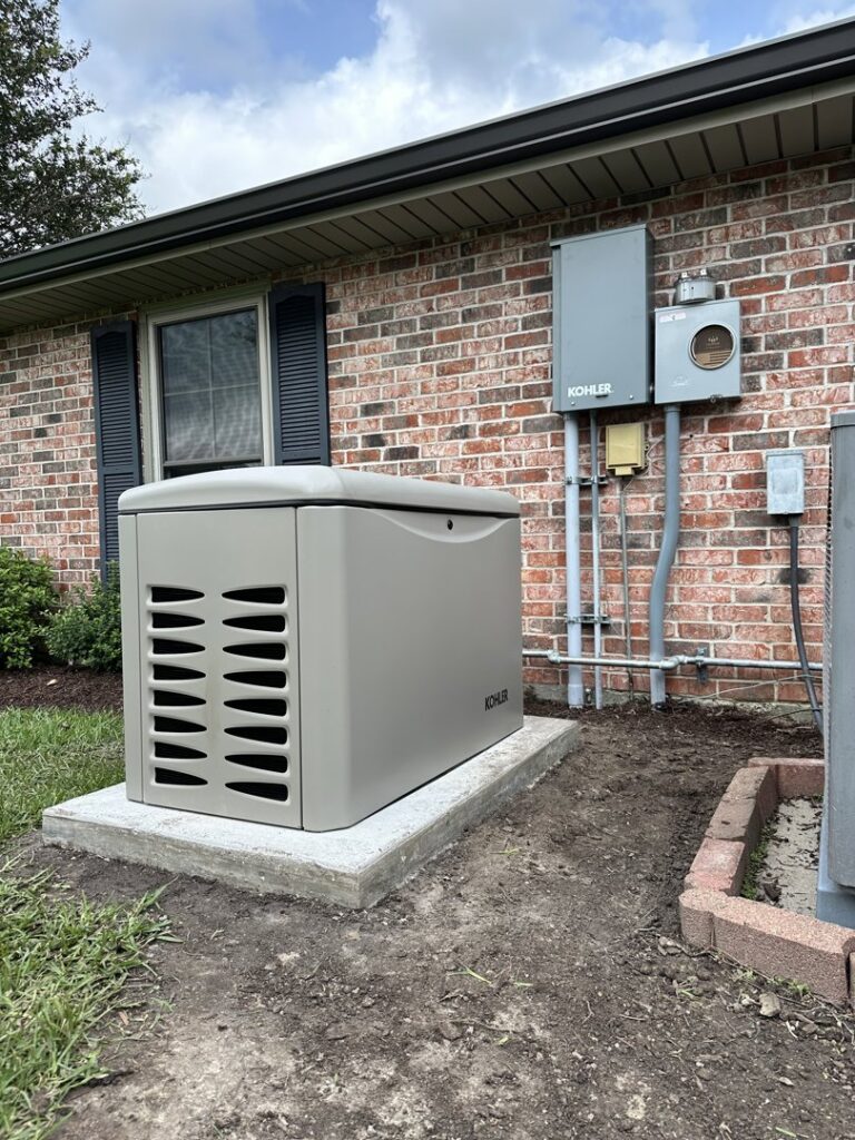 A new home standby generator installation with electrical conduits on the side of a brick house by Babcock Electric & Communications in Lake Charles, LA.