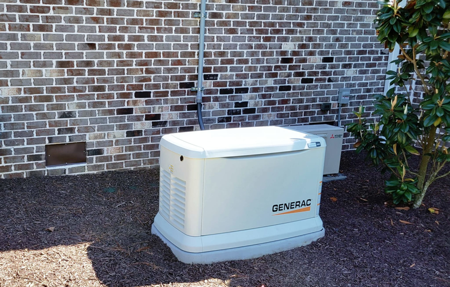 A Generac home standby generator installed next to a brick house by GGI Generators in Lexington, SC