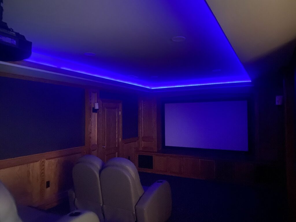 Custom blue LED strip lighting and recessed lights installed in a home theater by Abe Electric LLC in Wallingford, CT.