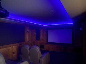 Custom blue LED strip lighting and recessed lights installed in a home theater by Abe Electric LLC in Wallingford, CT.
